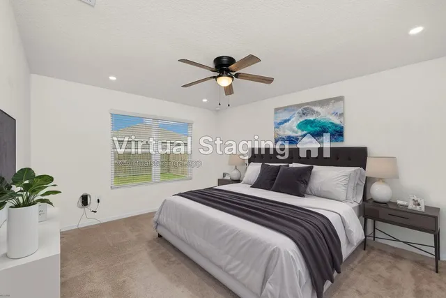 an empty room with a window and a ceiling fan