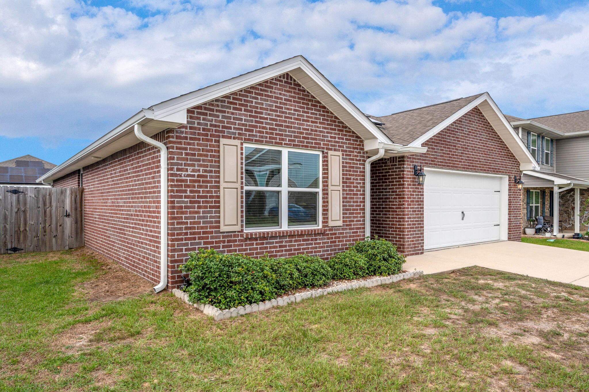 920 Merganser Way Crestview, FL 32539 - Photo 2 of 39 a front view of a house with a yard and garage