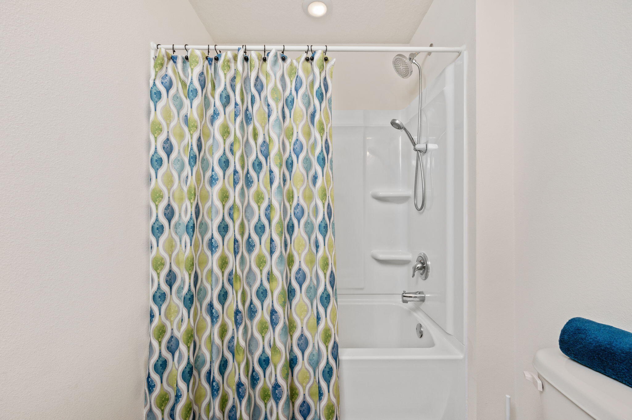 920 Merganser Way Crestview, FL 32539 - Photo 24 of 39 a bathroom with a shower curtain and a shower curtain