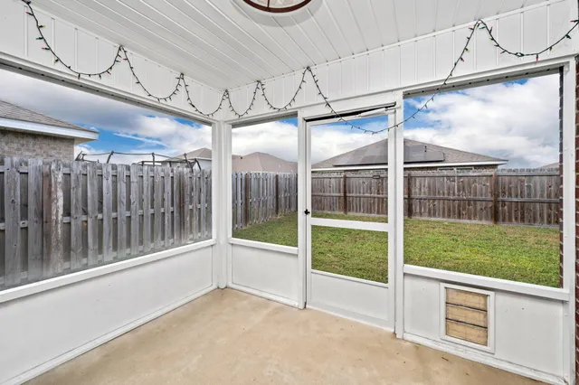 a view of a door with a wooden fence