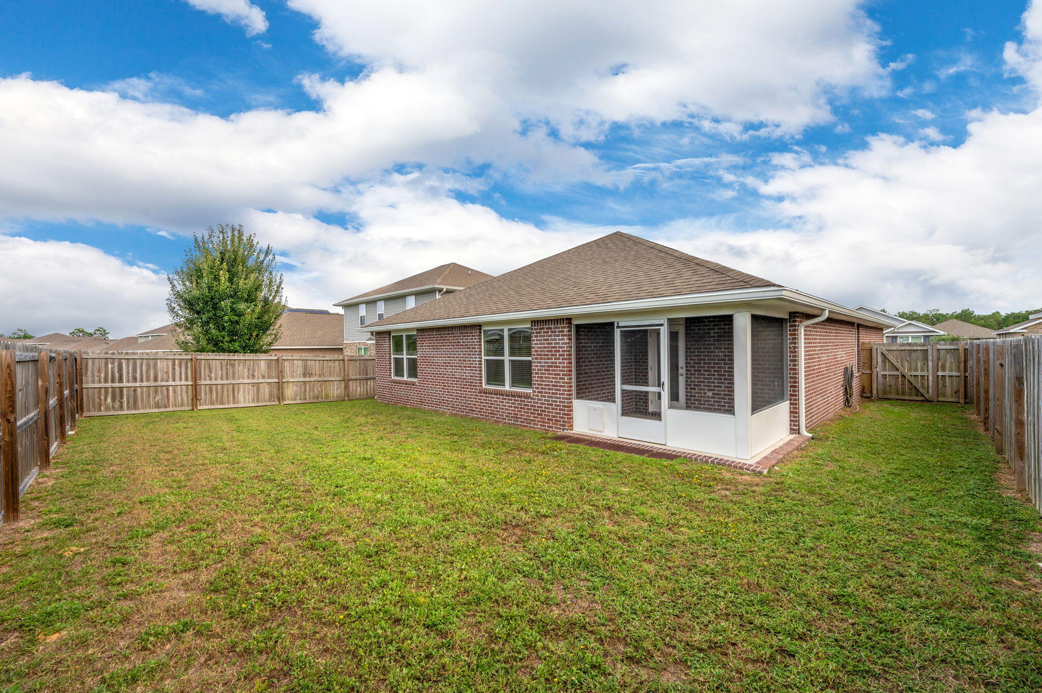 920 Merganser Way Crestview, FL 32539 - Photo 34 of 39 a front view of a house with garden