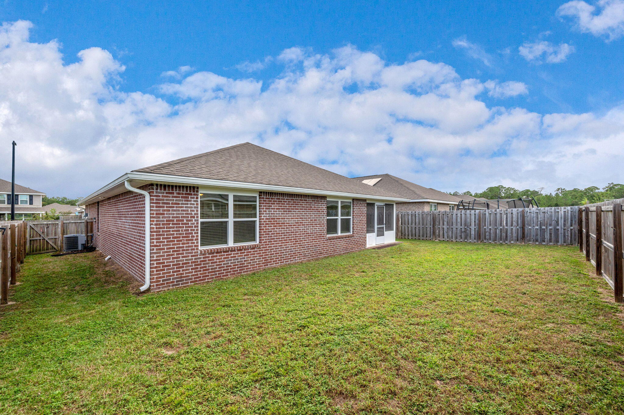 920 Merganser Way Crestview, FL 32539 - Photo 36 of 39 a front view of a house with garden