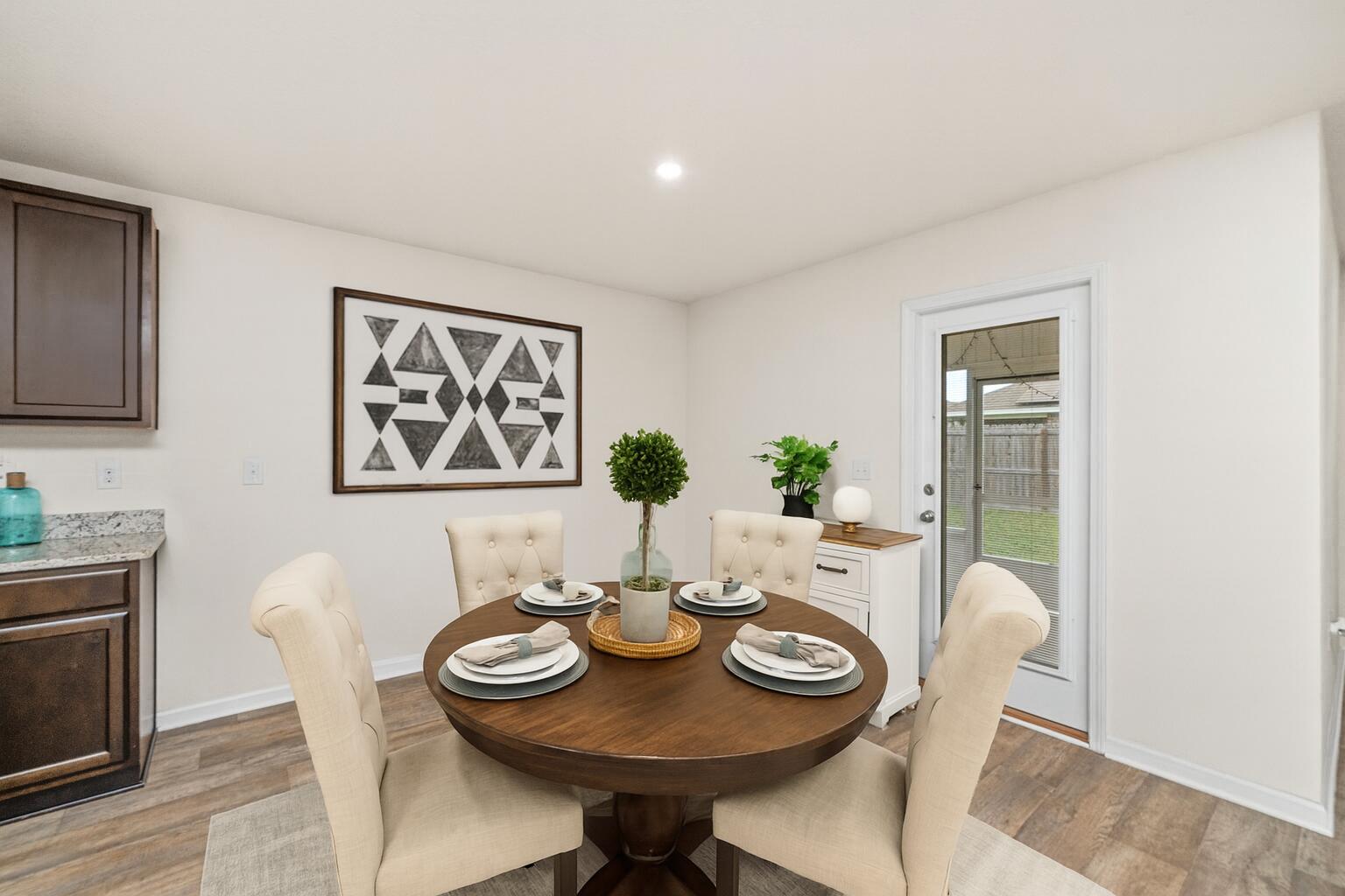 920 Merganser Way Crestview, FL 32539 - Photo 10 of 39 a view of a dining room with furniture and wooden floor