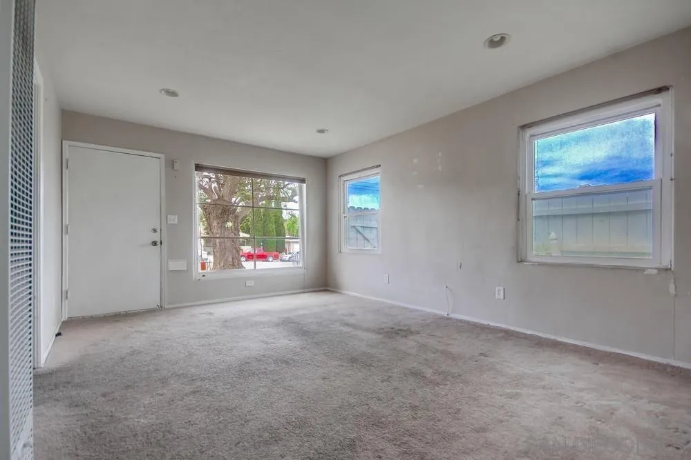 6316 Streamview Drive San Diego, CA 92115 - Photo 11 of 52 a view of an empty room with a window