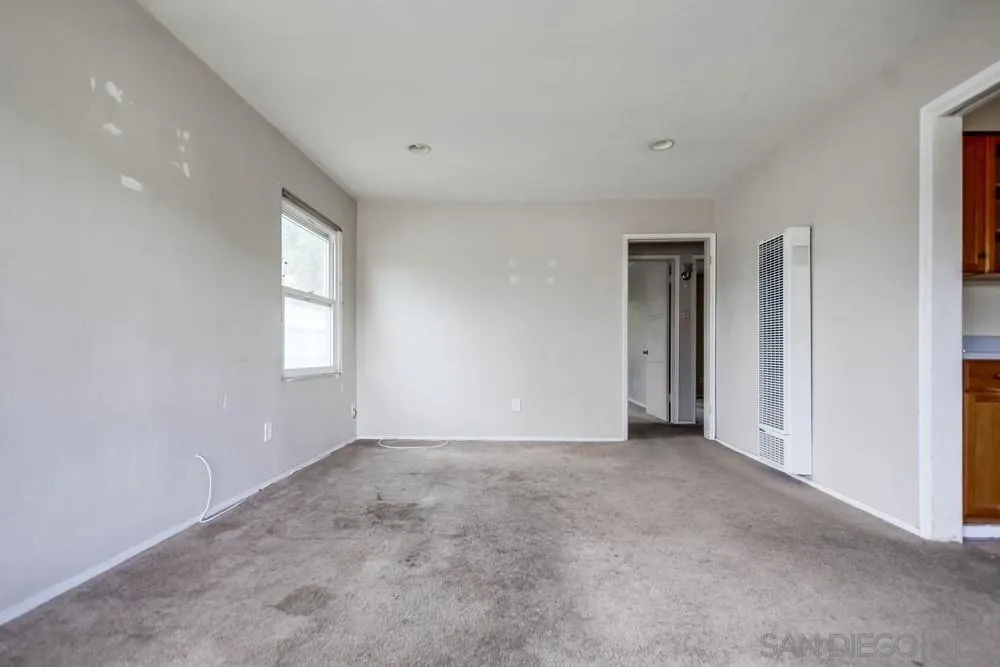 6316 Streamview Drive San Diego, CA 92115 - Photo 13 of 52 a view of an empty room with a window