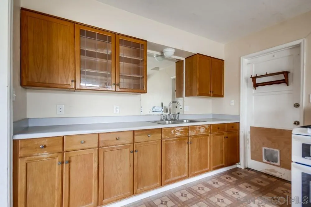 6316 Streamview Drive San Diego, CA 92115 - Photo 16 of 52 a bathroom with a sink and a mirror