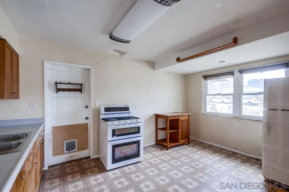 6316 Streamview Drive San Diego, CA 92115 - Photo 17 of 52 a view of workspace with furniture and windows