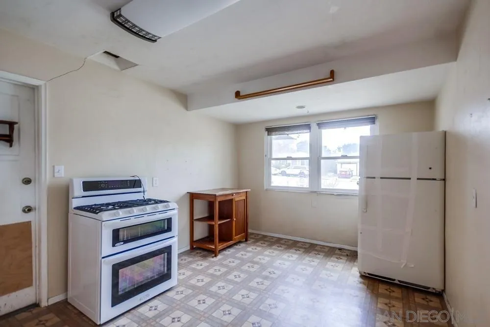 6316 Streamview Drive San Diego, CA 92115 - Photo 18 of 52 a view of kitchen and entryway with window