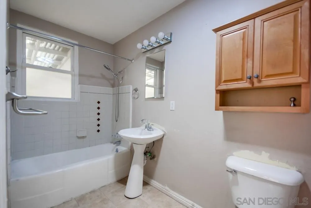 6316 Streamview Drive San Diego, CA 92115 - Photo 22 of 52 a bathroom with a sink a toilet and bathtub