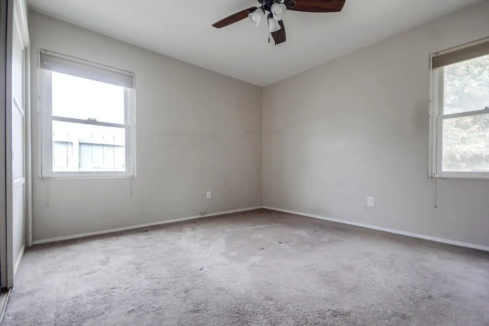 6316 Streamview Drive San Diego, CA 92115 - Photo 26 of 52 an empty room with a window