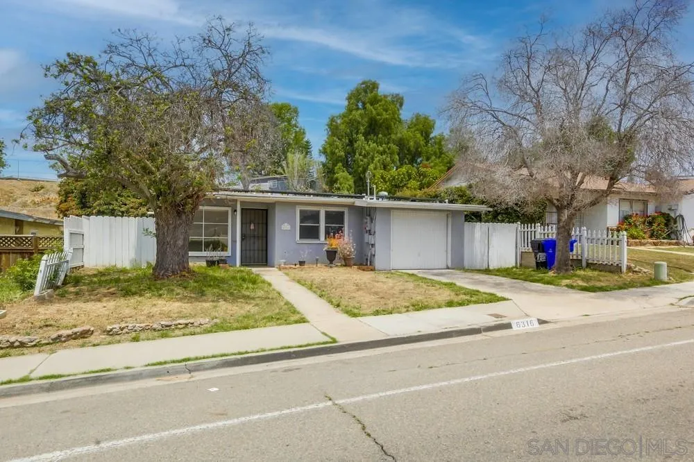 6316 Streamview Drive San Diego, CA 92115 - Photo 3 of 52 a house with trees in the background