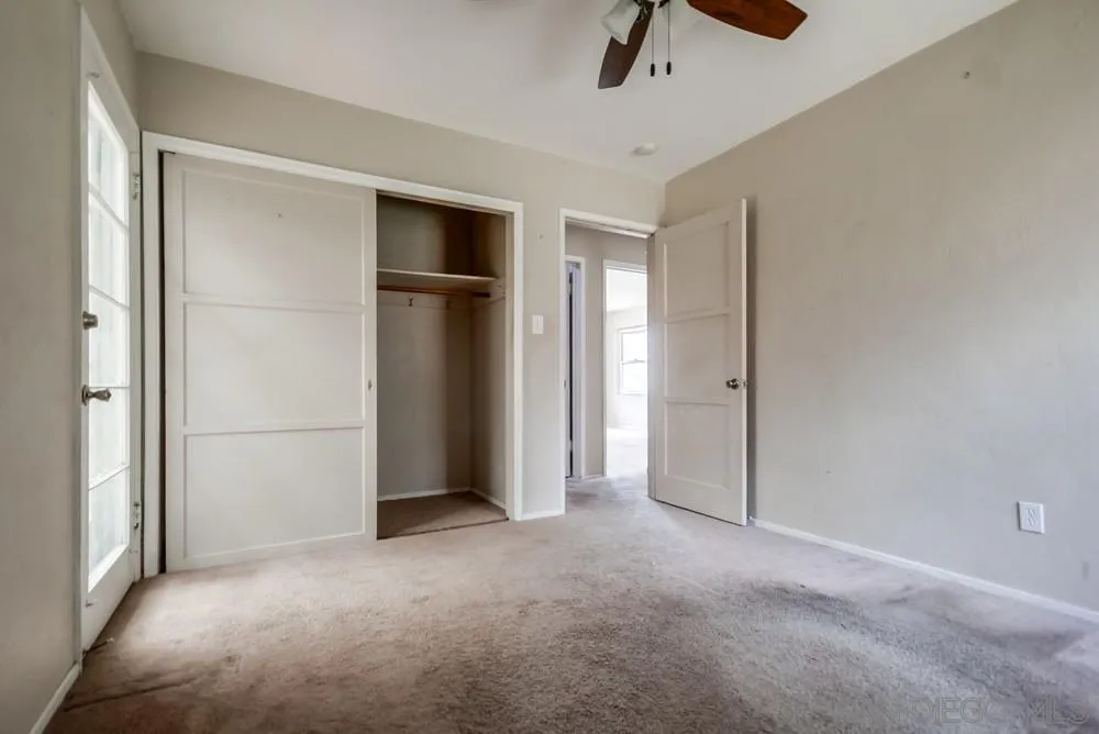 6316 Streamview Drive San Diego, CA 92115 - Photo 32 of 52 a view of empty room with ceiling fan