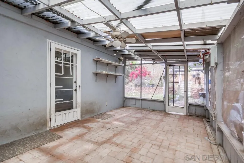 6316 Streamview Drive San Diego, CA 92115 - Photo 33 of 52 a view of empty room with wooden walls