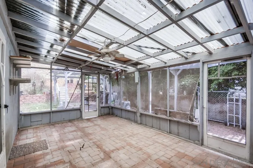 6316 Streamview Drive San Diego, CA 92115 - Photo 34 of 52 a view of empty room with wooden walls