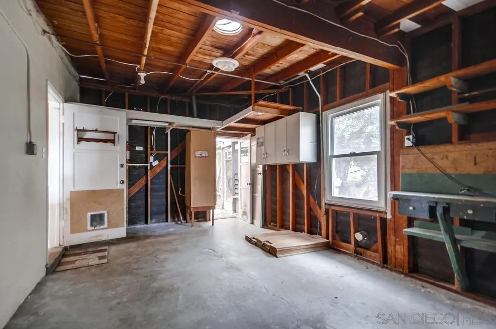 6316 Streamview Drive San Diego, CA 92115 - Photo 37 of 52 a view of a room with wooden walls