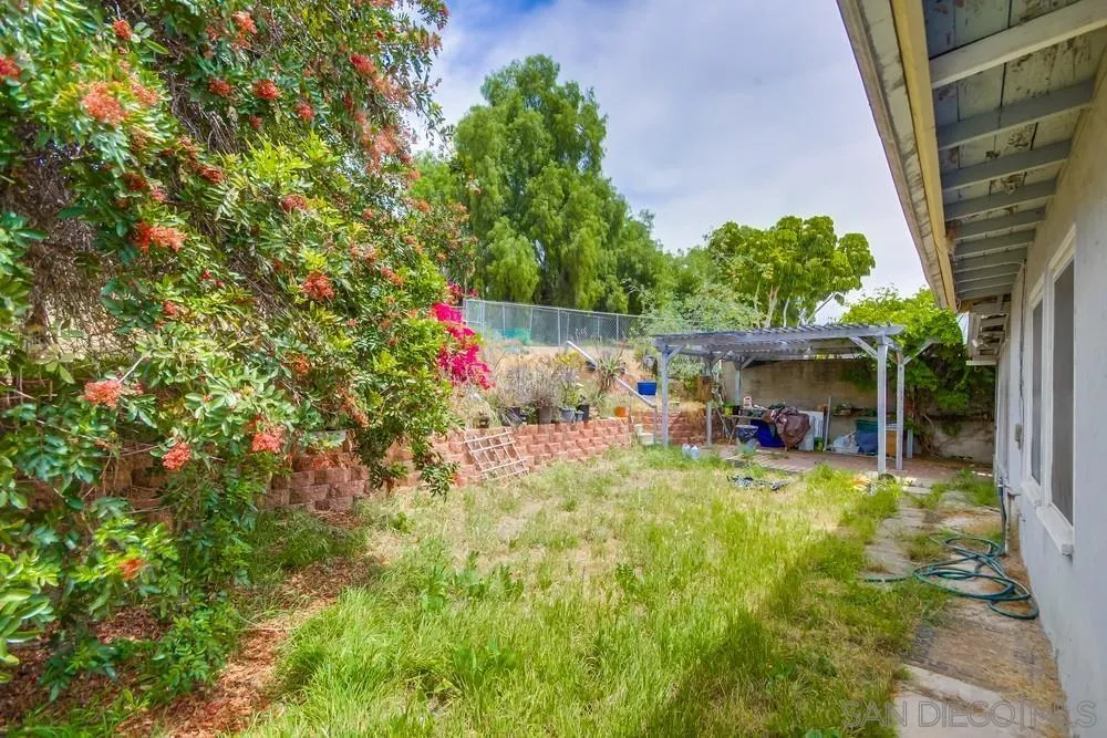6316 Streamview Drive San Diego, CA 92115 - Photo 43 of 52 a view of a house with backyard and sitting area
