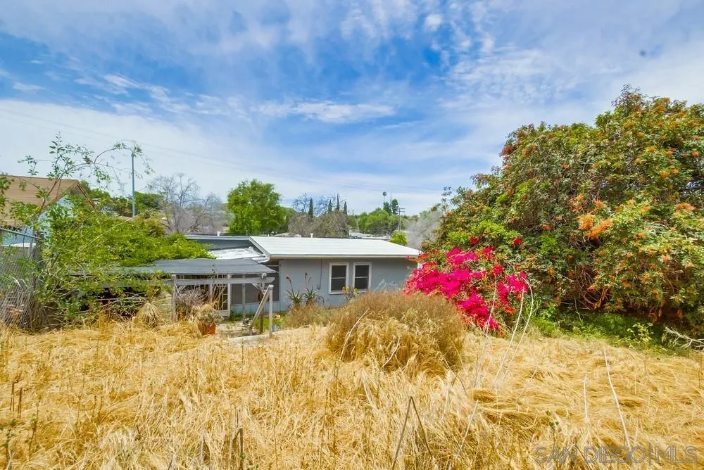 6316 Streamview Drive San Diego, CA 92115 - Photo 50 of 52 a front view of a house with a yard