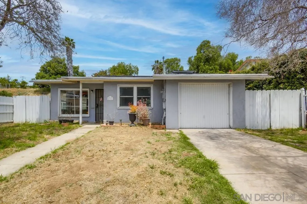 6316 Streamview Drive San Diego, CA 92115 - Photo 5 of 52 a front view of a house with a garden