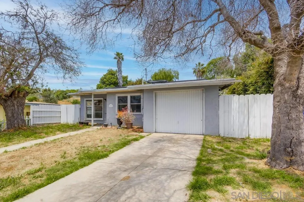 6316 Streamview Drive San Diego, CA 92115 - Photo 6 of 52 a front view of a house with garden