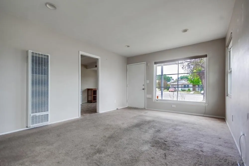 6316 Streamview Drive San Diego, CA 92115 - Photo 10 of 52 a view of an empty room with a window