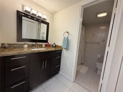 a view of storage and utility room with washer and dryer