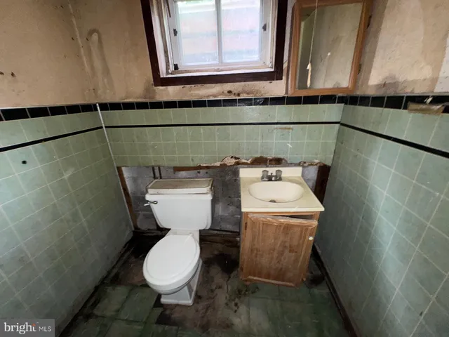 a bathroom with a toilet and a sink