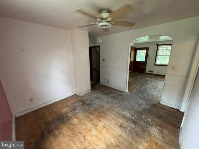 a view of a big room with closet and fan