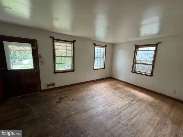 an empty room with windows