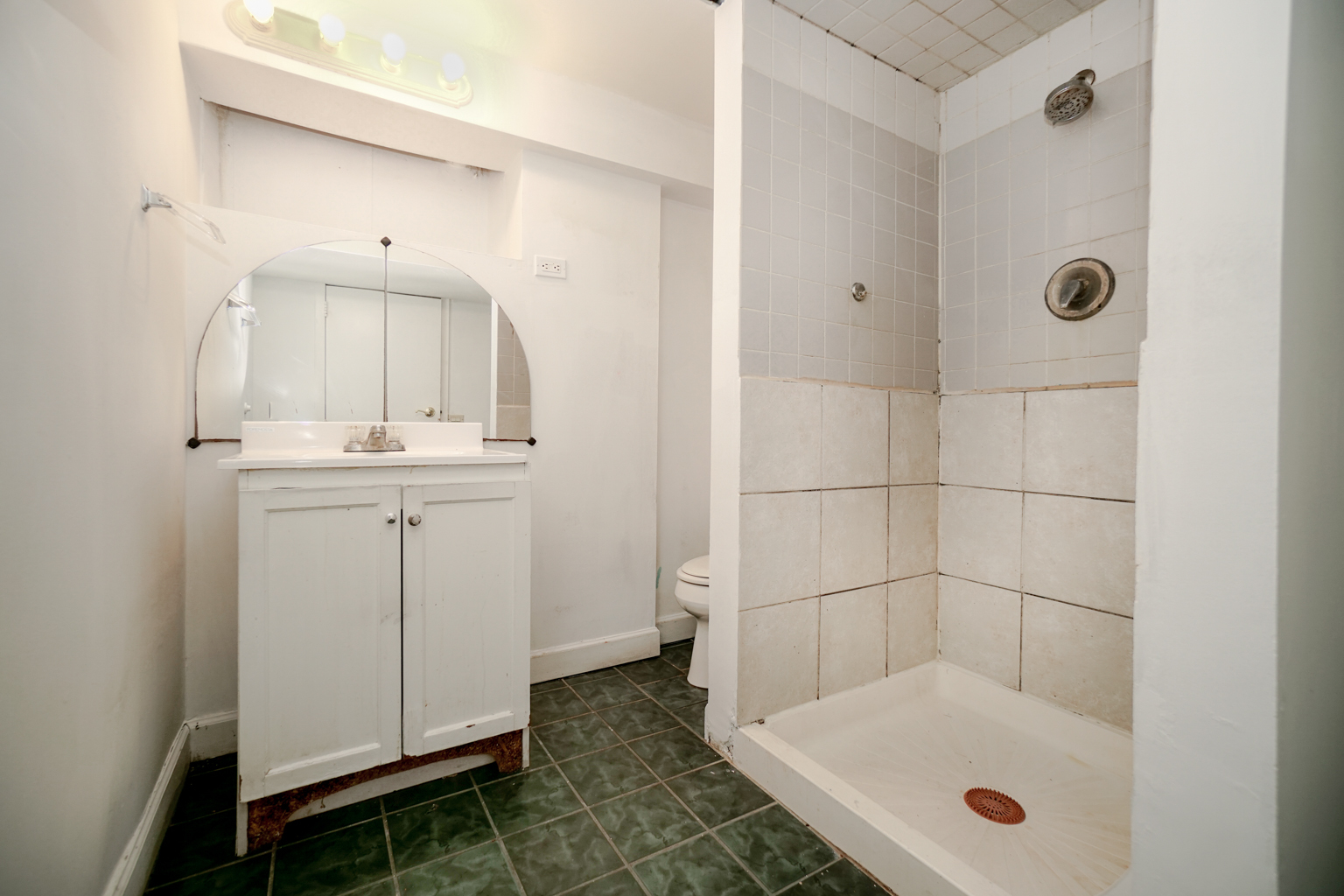 1010 North Elmhurst Road Prospect Heights, IL 60070 - Photo 12 of 15 a bathroom with a sink and mirror