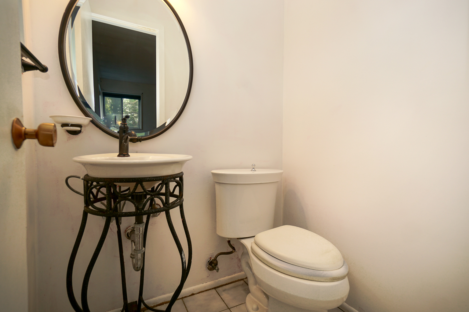 1010 North Elmhurst Road Prospect Heights, IL 60070 - Photo 10 of 15 a bathroom with a toilet and a mirror
