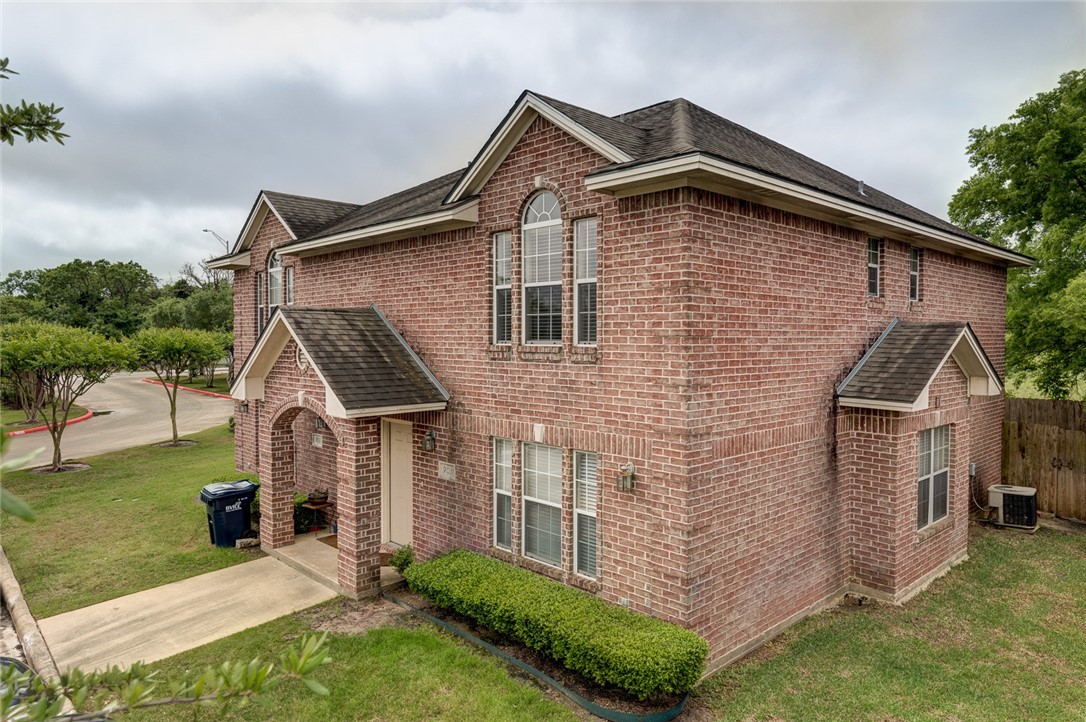 910 Monte Carlo College Station, TX 77840 - Photo 1 of 20 a front view of house with yard and green space