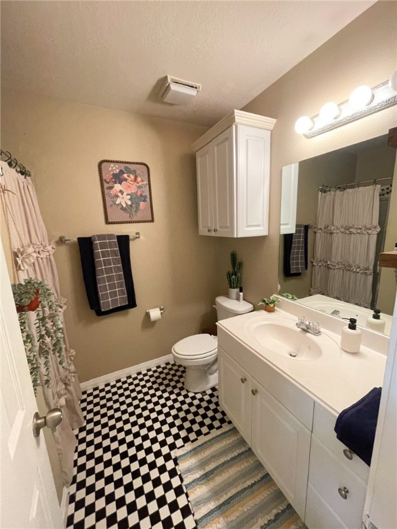 910 Monte Carlo College Station, TX 77840 - Photo 13 of 20 a bathroom with a sink a toilet and a shower