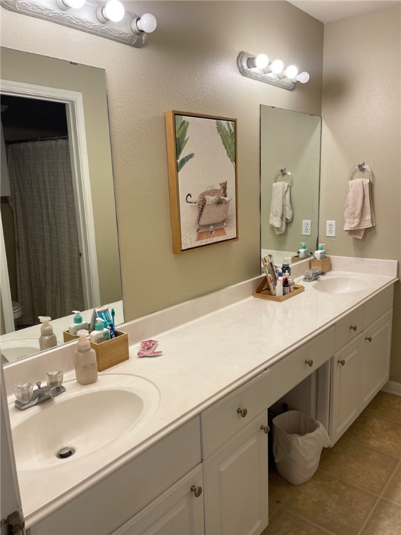 910 Monte Carlo College Station, TX 77840 - Photo 16 of 20 a bathroom with a sink and a mirror