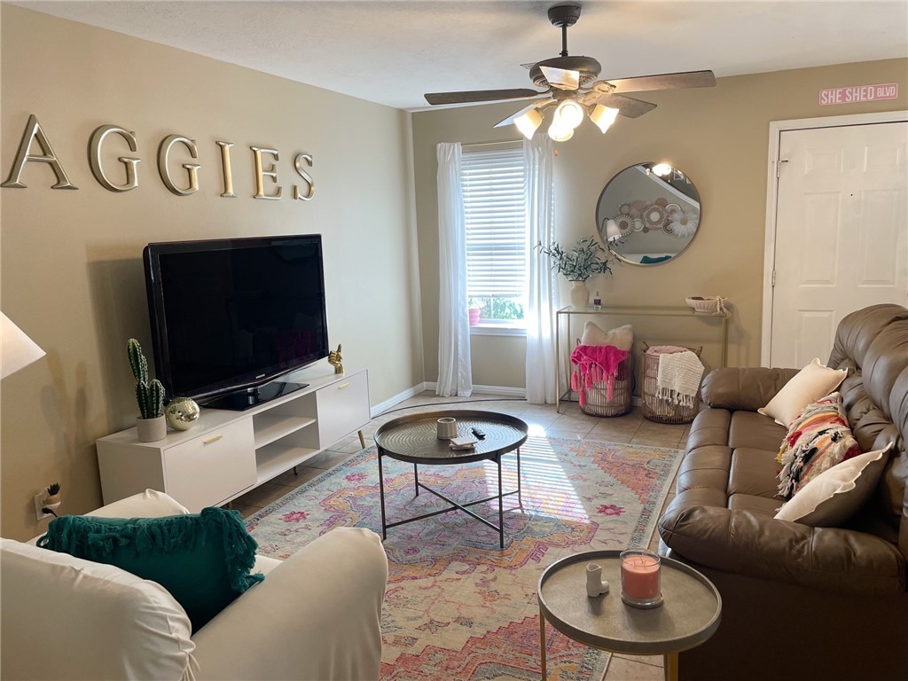 910 Monte Carlo College Station, TX 77840 - Photo 3 of 20 a living room with furniture and a flat screen tv