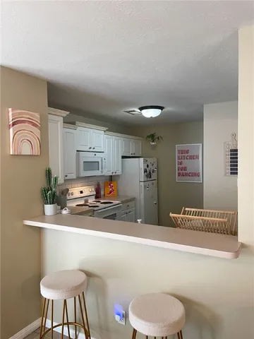 a bathroom with a sink a toilet and a shower