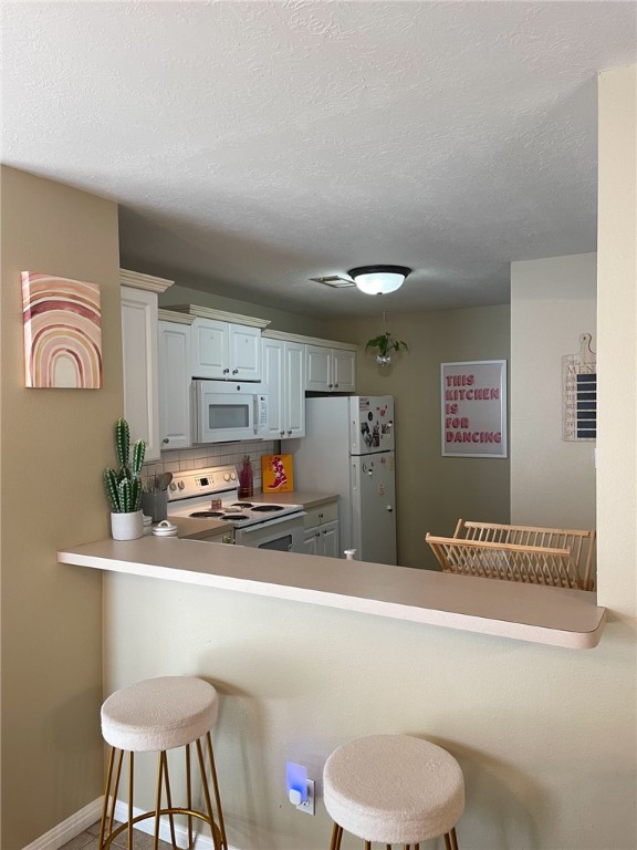 910 Monte Carlo College Station, TX 77840 - Photo 5 of 20 a bathroom with a sink a toilet and a shower