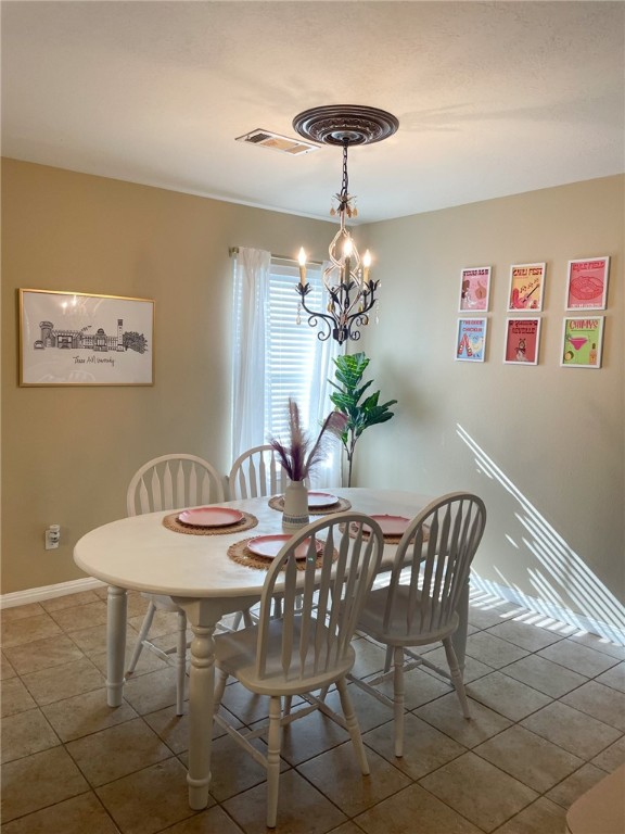 910 Monte Carlo College Station, TX 77840 - Photo 7 of 20 a view of a dining room with furniture and chandelier