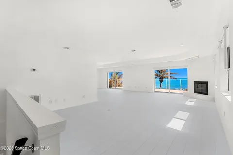 a view of kitchen with furniture and white appliances