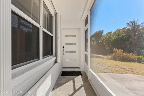 a spacious bedroom with a bed and a cabinets
