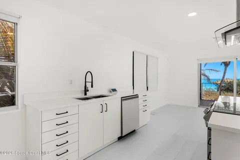 a view of a hallway view with staircase