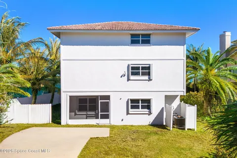 a view of a tree in front of a house