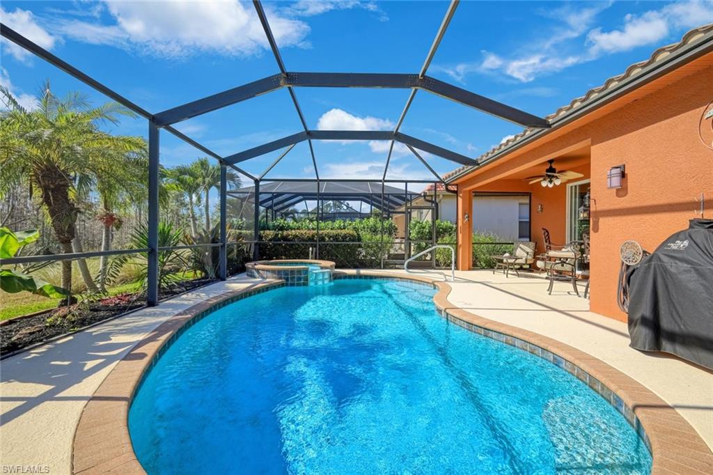 21025 Bella Terra Boulevard Estero, FL 33928 - Photo 10 of 35 a view of a backyard with swimming pool
