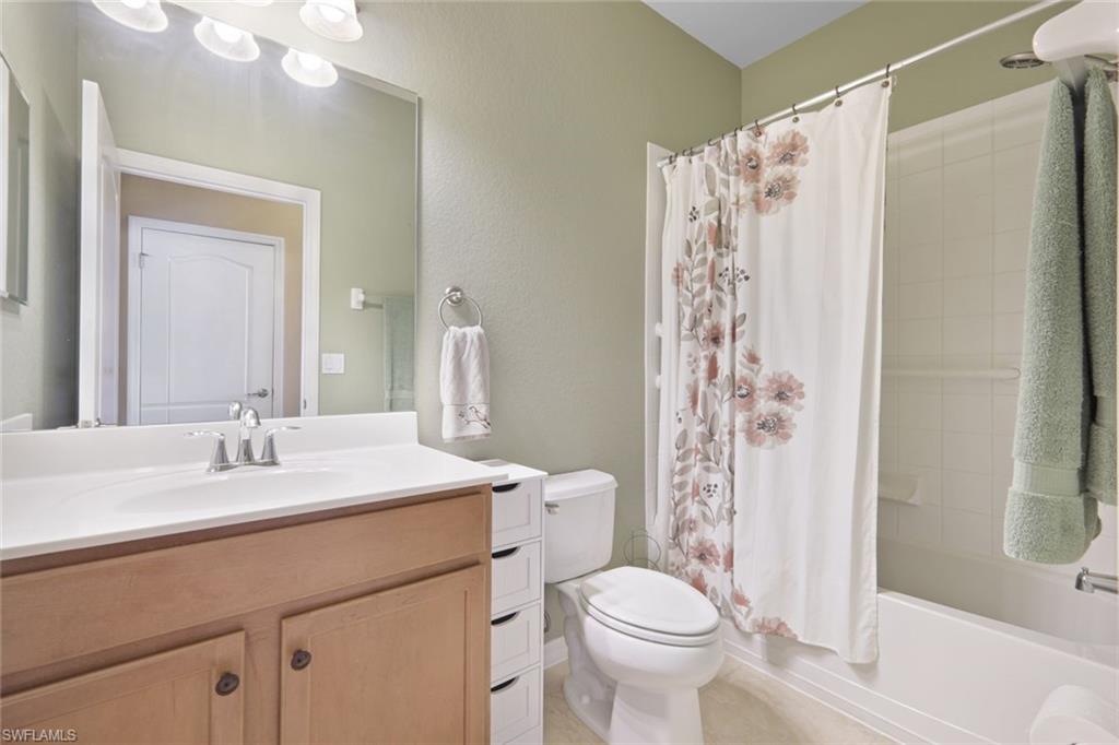 21025 Bella Terra Boulevard Estero, FL 33928 - Photo 18 of 35 a bathroom with a sink a toilet and shower