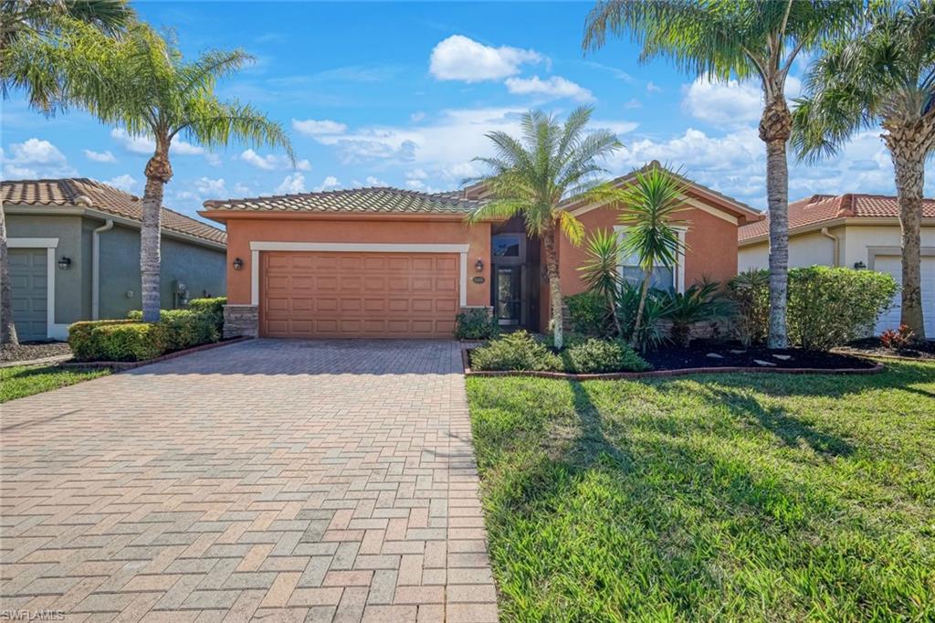 21025 Bella Terra Boulevard Estero, FL 33928 - Photo 20 of 35 a front view of house with yard and green space