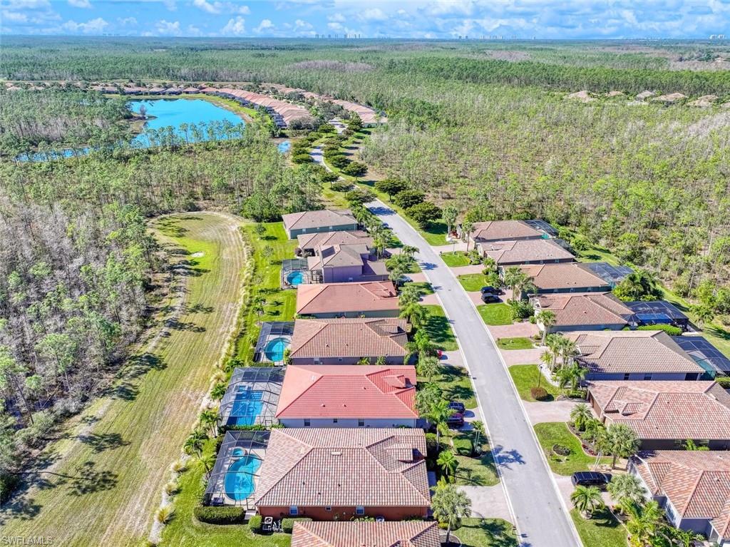 21025 Bella Terra Boulevard Estero, FL 33928 - Photo 24 of 35 an aerial view of residential houses with outdoor space