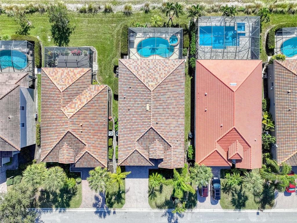 21025 Bella Terra Boulevard Estero, FL 33928 - Photo 27 of 35 an aerial view of a house with garden space and street view