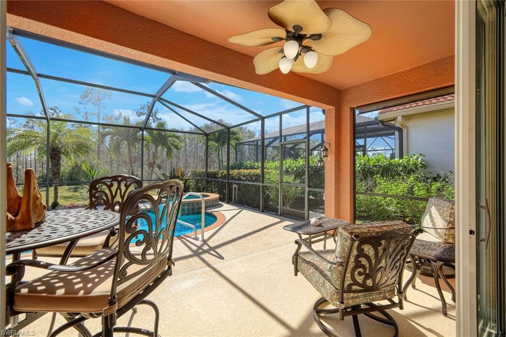 21025 Bella Terra Boulevard Estero, FL 33928 - Photo 7 of 35 a view of a patio with a table and chairs