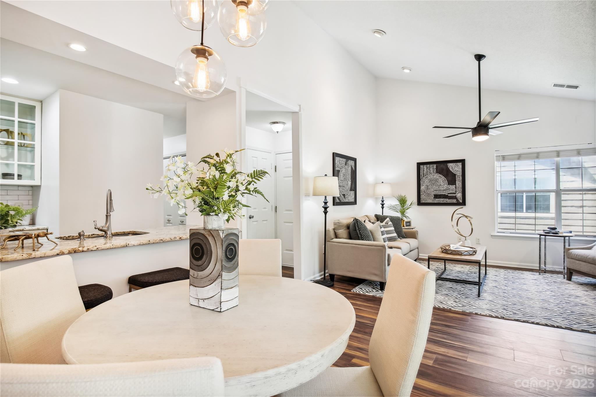 5007 Sharon Road, Unit E Charlotte, NC 28210 - Photo 12 of 30 a dining room with furniture and wooden floor