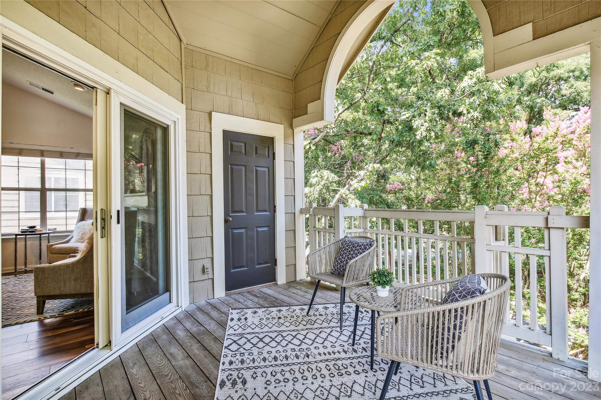 5007 Sharon Road, Unit E Charlotte, NC 28210 - Photo 15 of 30 a view of a chair and table in the balcony