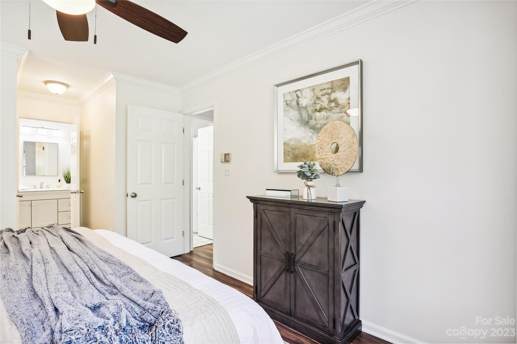 5007 Sharon Road, Unit E Charlotte, NC 28210 - Photo 19 of 30 a bedroom with a bed and a dresser